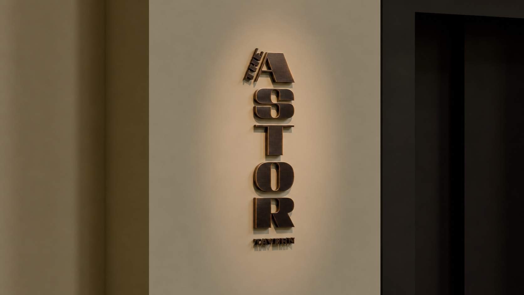 Vertical metal dimensional lettering mounted on an interior wall